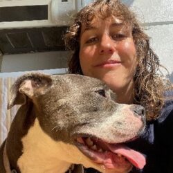 woman with grey and white dog