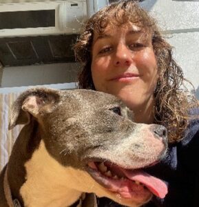 woman with grey and white dog